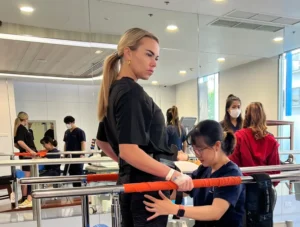 Julia receiving walking therapy at Verita Neuro