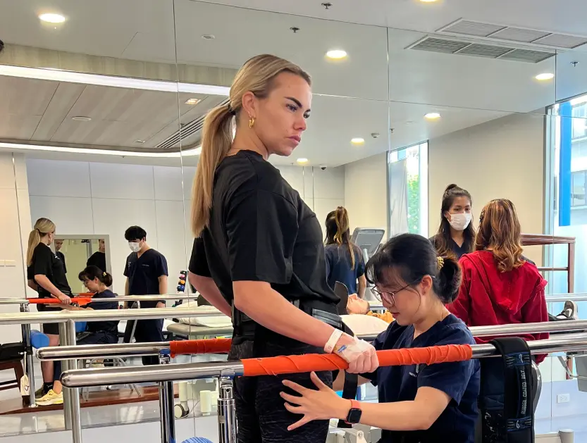 Julia receiving walking therapy at Verita Neuro