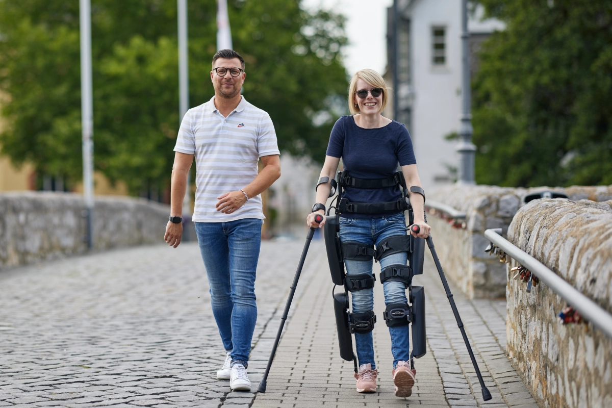 Verita Neuro Blog Post Feature Image ReWalk® Personal Robotic Exoskeleton Anouk and Marcel on Bridge2